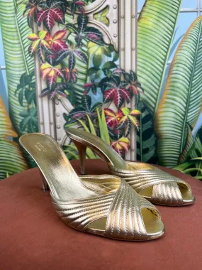 Gucci gold pumps