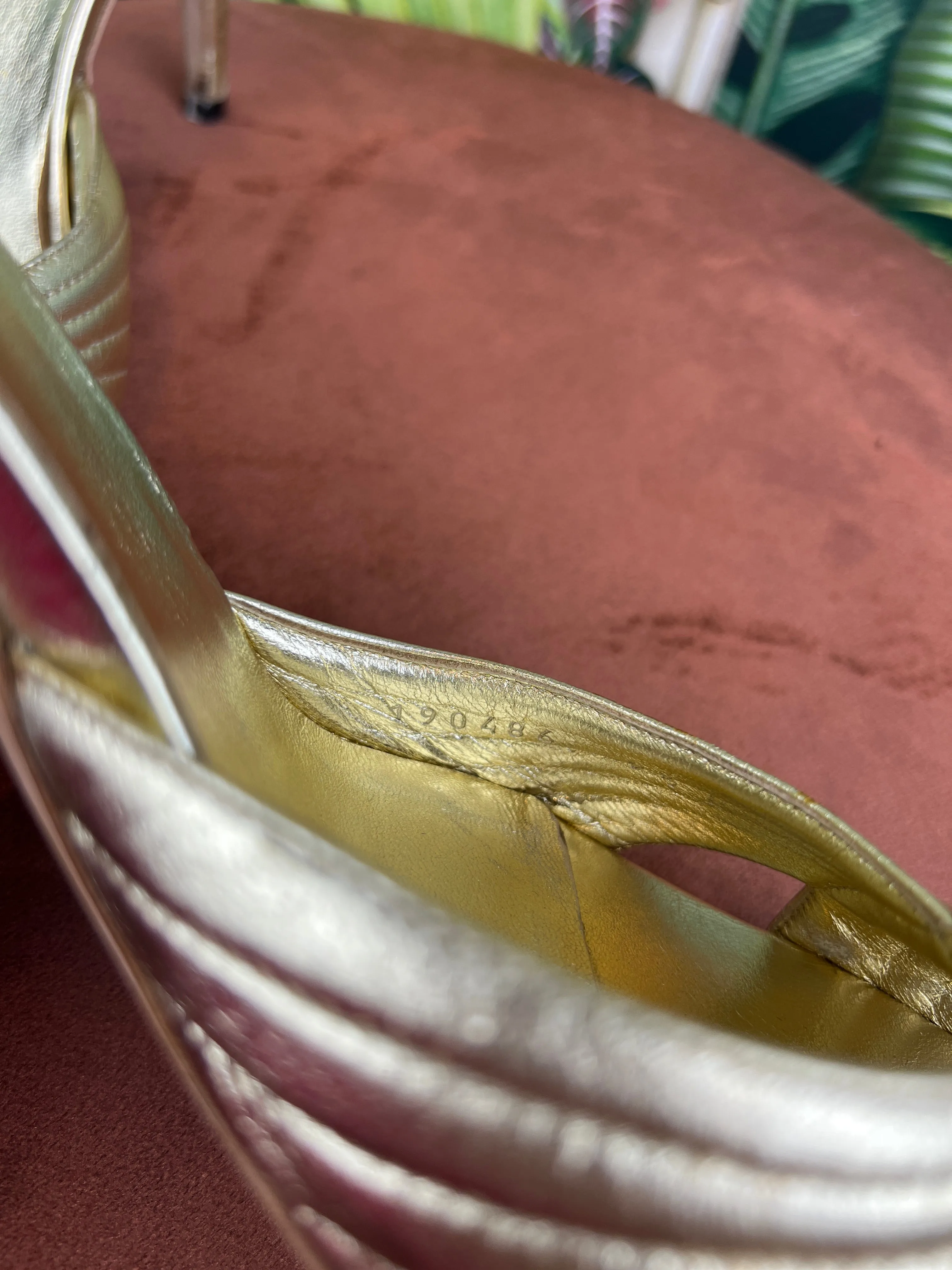 Gucci gold pumps