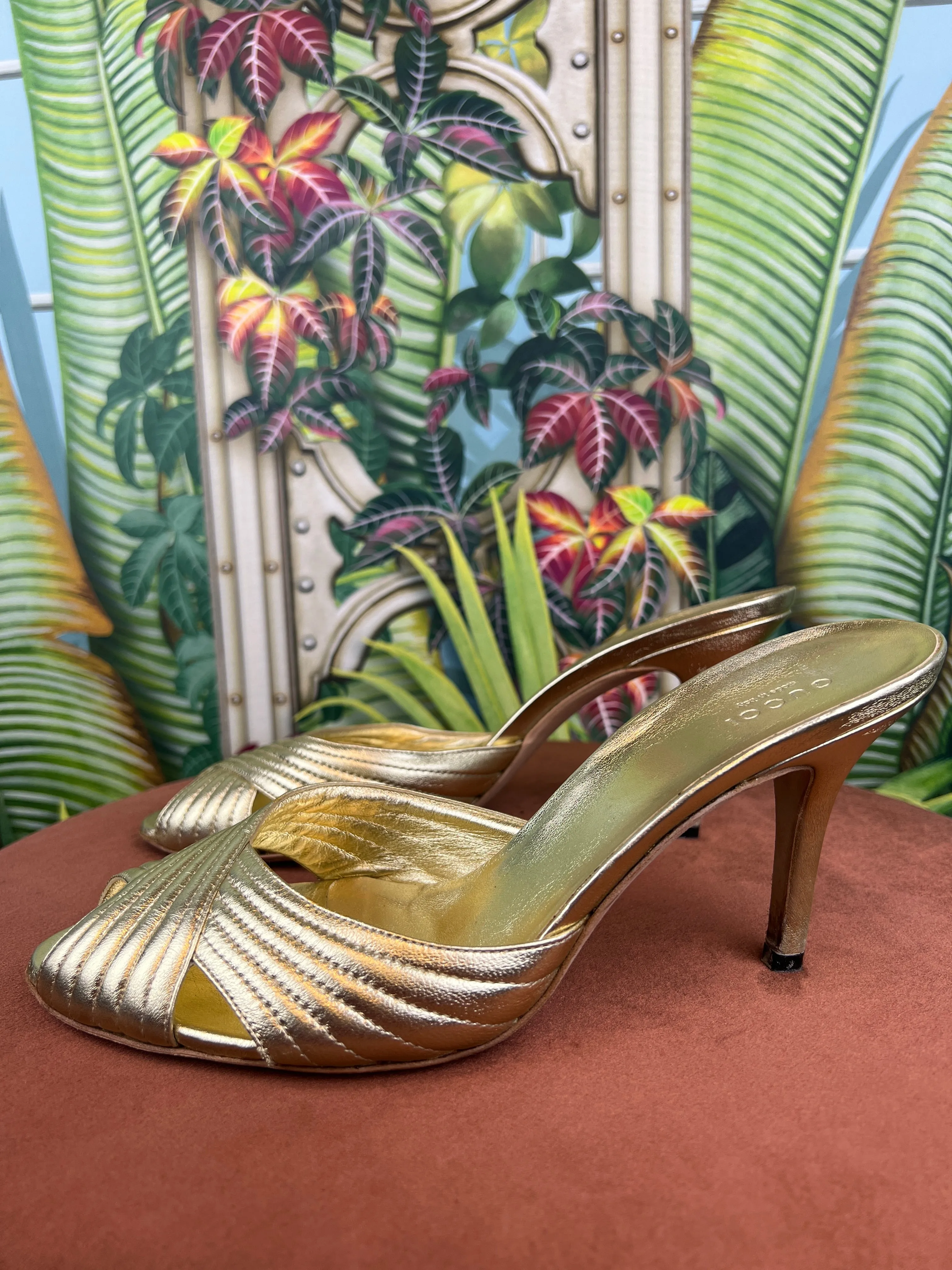 Gucci gold pumps